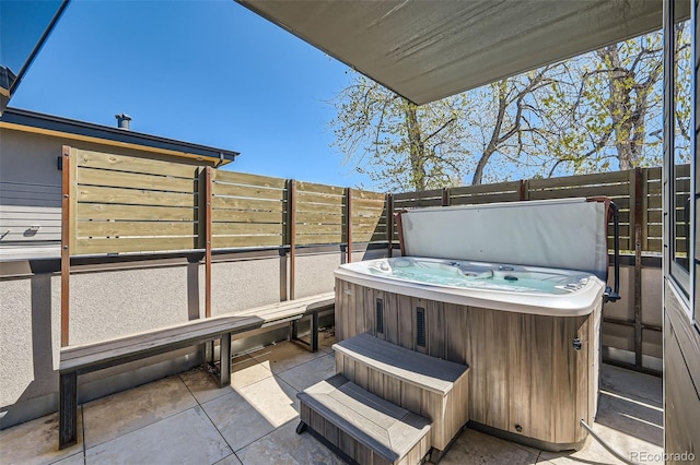 427 Milwaukee St, Denver, CO 80206 - view of patio with a hot tub and fence