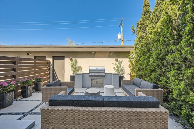 427 Milwaukee St, Denver, CO 80206 - view of patio / terrace featuring fence, an outdoor kitchen, an outdoor hangout area, and a grill