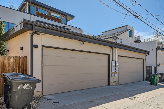 427 Milwaukee St, Denver, CO 80206 - garage featuring fence and driveway