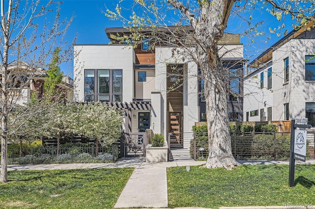 427 Milwaukee St, Denver, CO 80206 - view of front facade featuring a gate, a fenced front yard, and a front yard