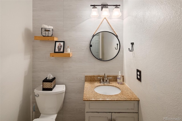 13777 W Amherst Way, Lakewood, CO 80228 - bathroom featuring vanity and toilet