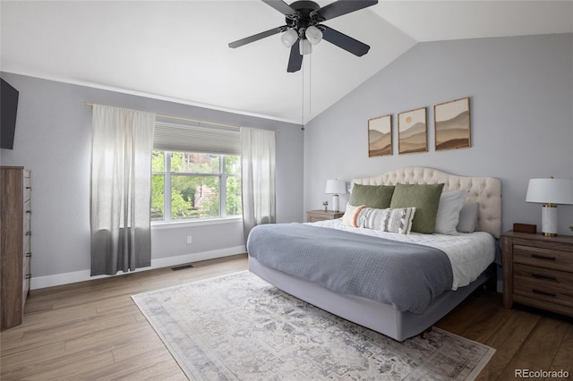 13777 W Amherst Way, Lakewood, CO 80228 - bedroom with vaulted ceiling, wood finished floors, baseboards, and ceiling fan