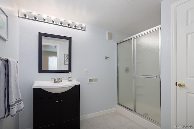 13777 W Amherst Way, Lakewood, CO 80228 - bathroom with vanity, a shower stall, and tile patterned flooring