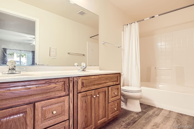1148 Opal St Unit 101, Broomfield, CO 80020 - bathroom with wood finished floors, toilet, vanity, and shower / tub combo with curtain