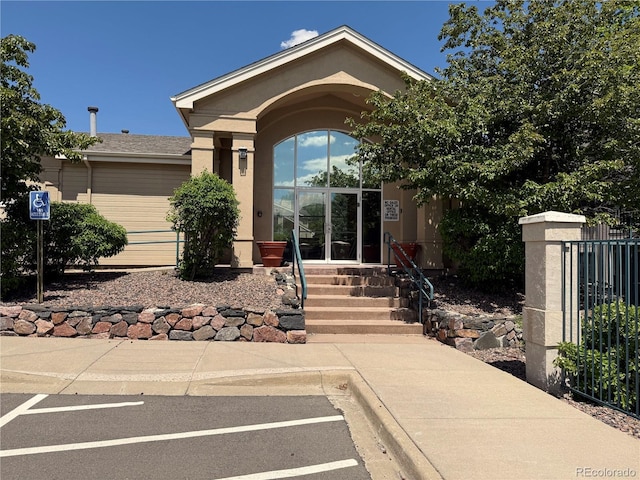 1148 Opal St Unit 101, Broomfield, CO 80020 - property entrance featuring stucco siding and fence
