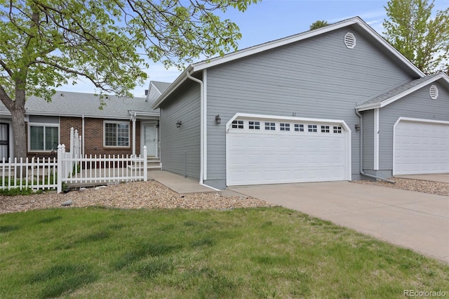 view of front of property with a garage and driveway