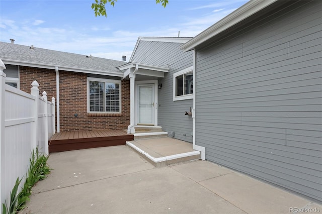 view of patio / terrace with fence and a wooden deck