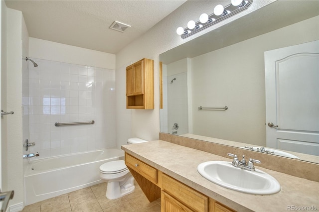 930 Button Rock Dr Unit 29, Longmont, CO 80504 - bathroom featuring vanity, washtub / shower combination, tile patterned flooring, and a textured ceiling