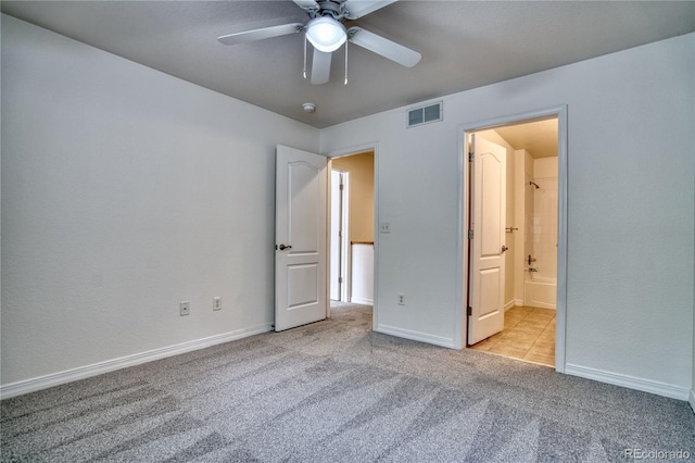930 Button Rock Dr Unit 29, Longmont, CO 80504 - unfurnished bedroom with carpet flooring, connected bathroom, and ceiling fan
