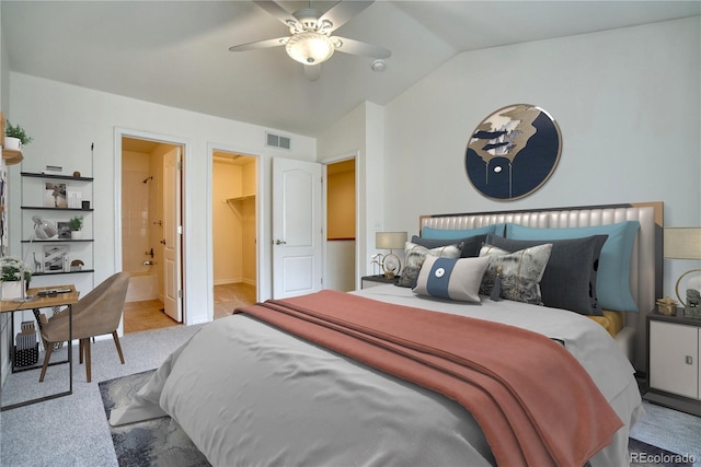 930 Button Rock Dr Unit 29, Longmont, CO 80504 - bedroom featuring lofted ceiling, a spacious closet, light colored carpet, a ceiling fan, and ensuite bathroom