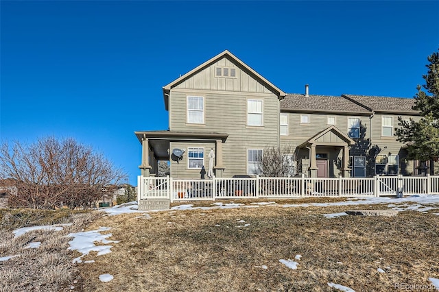 view of property with a porch and board and batten siding