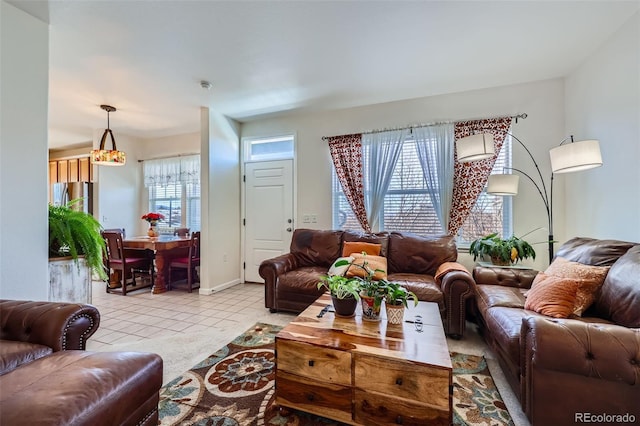 living room featuring light tile patterned flooring and baseboards