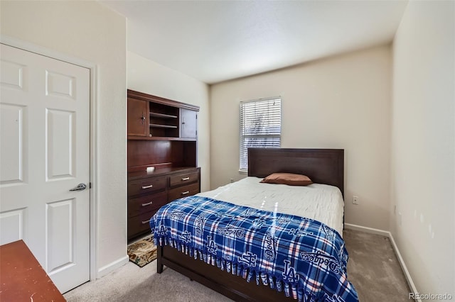 carpeted bedroom with baseboards