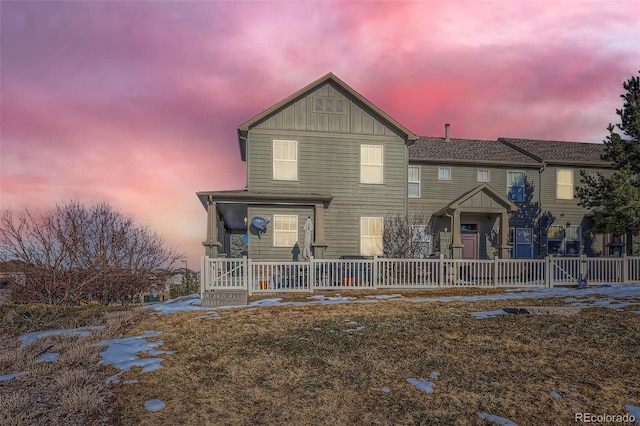 view of property with a porch and board and batten siding