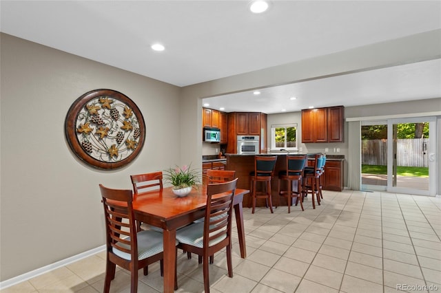 6143 S Ash Cir E, Centennial, CO 80121 - dining area with recessed lighting and light tile patterned flooring