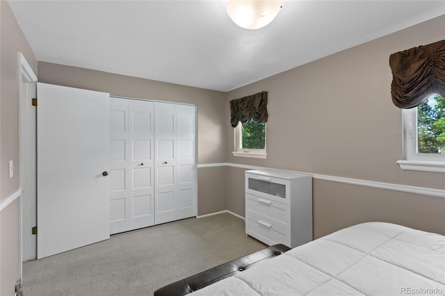 6143 S Ash Cir E, Centennial, CO 80121 - carpeted bedroom featuring a closet and baseboards