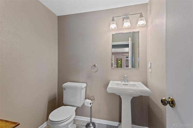 6143 S Ash Cir E, Centennial, CO 80121 - half bath featuring toilet and baseboards