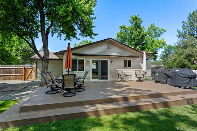 6143 S Ash Cir E, Centennial, CO 80121 - rear view of property with outdoor dining area and a wooden deck