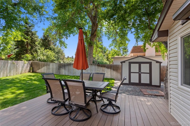 6143 S Ash Cir E, Centennial, CO 80121 - deck featuring a storage shed, outdoor dining space, and a fenced backyard