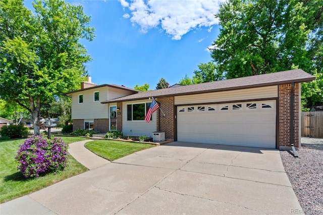 6143 S Ash Cir E, Centennial, CO 80121 - split level home with brick siding, driveway, and a garage
