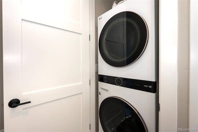 washroom featuring stacked washer and dryer