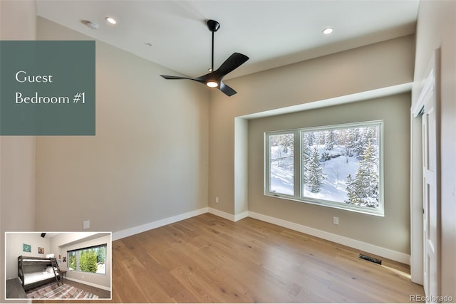 unfurnished room featuring light wood-type flooring and ceiling fan