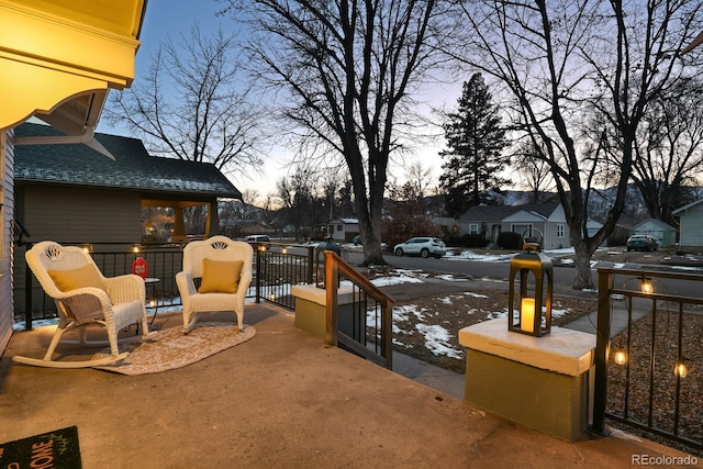 view of patio terrace at dusk