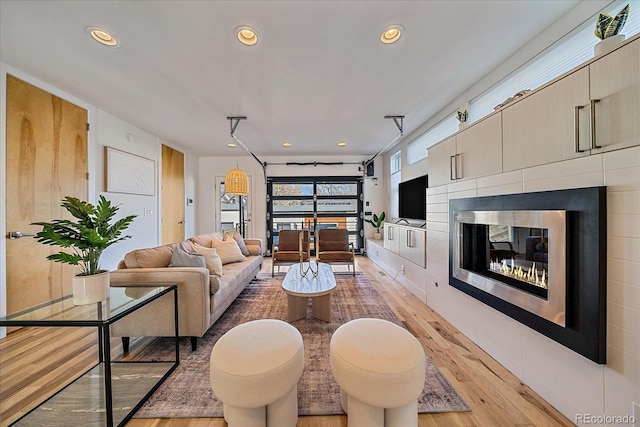 living room featuring recessed lighting and light wood-style floors