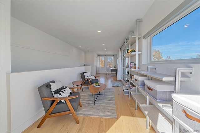 sitting room featuring light wood-type flooring and recessed lighting