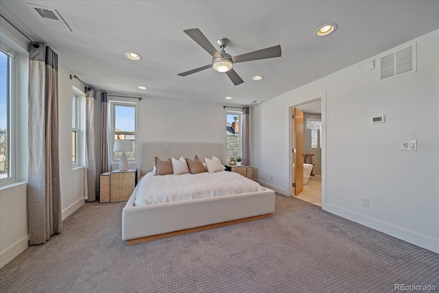 carpeted bedroom featuring recessed lighting, visible vents, and baseboards