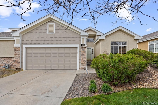 22312 E Plymouth Cir, Aurora, CO 80016 - ranch-style home with stone siding, an attached garage, stucco siding, and driveway