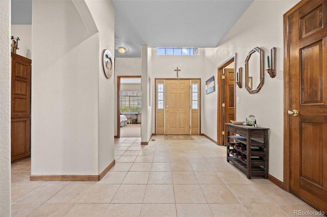 22312 E Plymouth Cir, Aurora, CO 80016 - foyer entrance featuring light tile patterned floors and baseboards