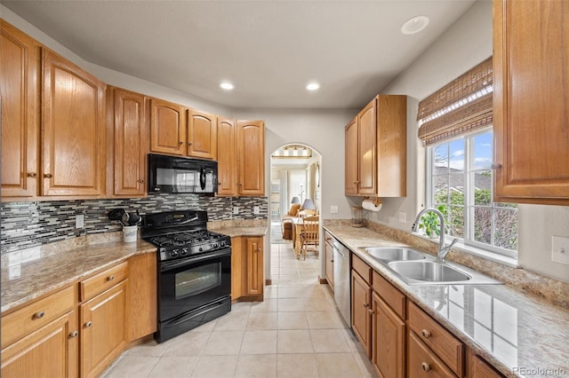 22312 E Plymouth Cir, Aurora, CO 80016 - kitchen with black appliances, a sink, decorative backsplash, light tile patterned flooring, and light stone counters