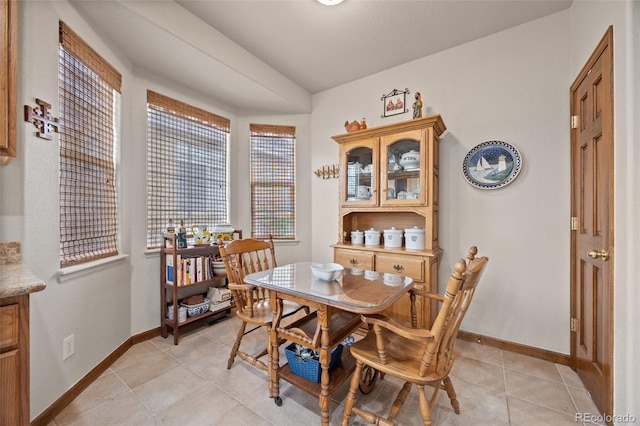 22312 E Plymouth Cir, Aurora, CO 80016 - dining area with light tile patterned flooring and baseboards