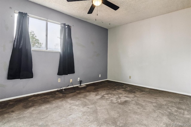 carpeted spare room featuring a textured ceiling and ceiling fan