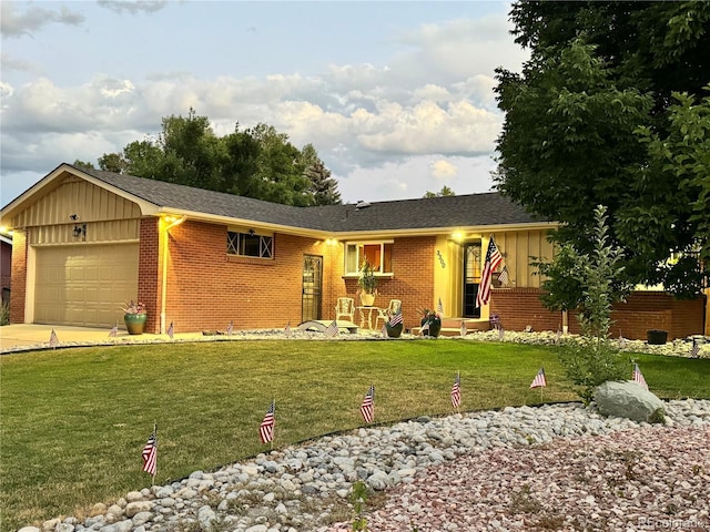 ranch-style home featuring a garage and a front yard