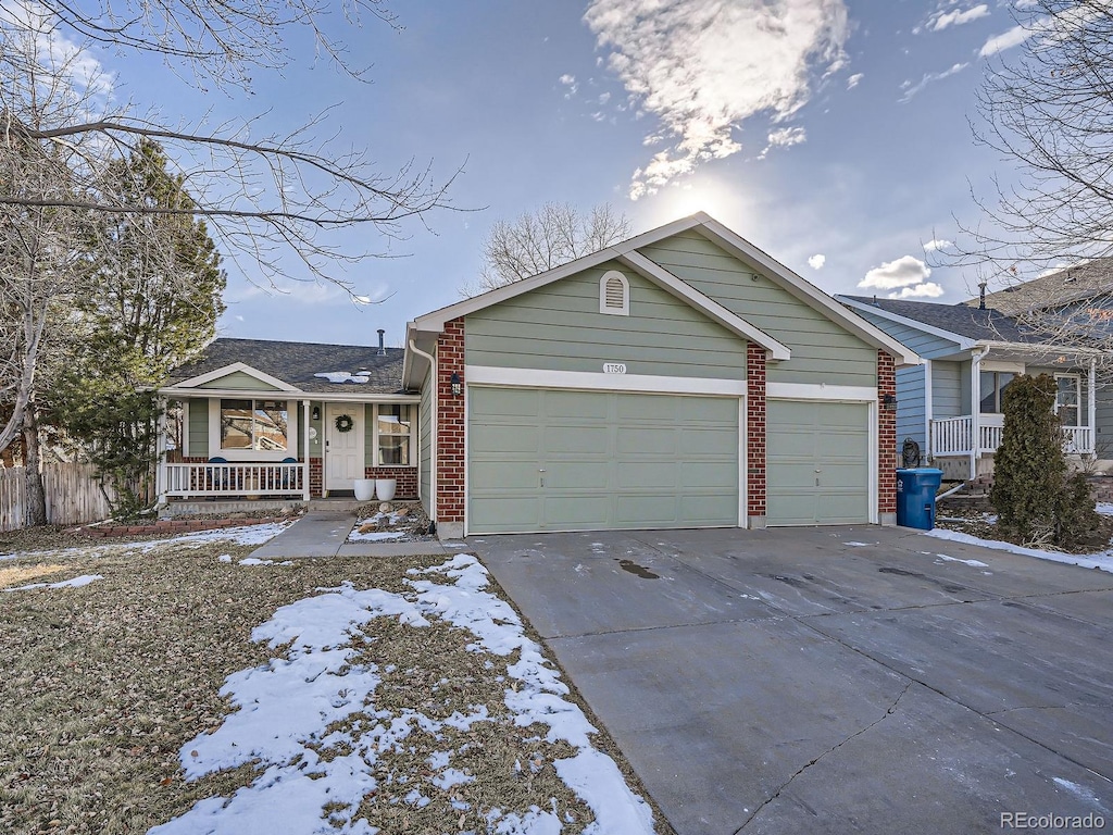 view of front of house featuring a garage and a porch