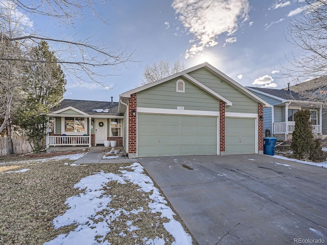 view of front of house featuring a garage and a porch