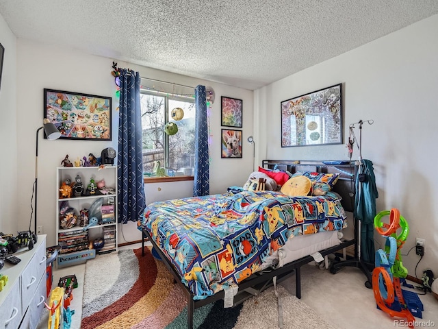 bedroom featuring carpet flooring and a textured ceiling