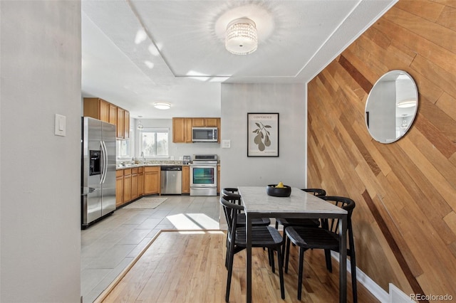 tiled dining area with wood walls