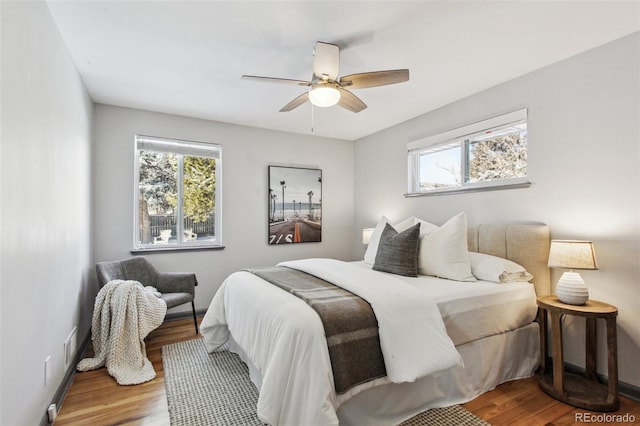 bedroom featuring hardwood / wood-style flooring and ceiling fan