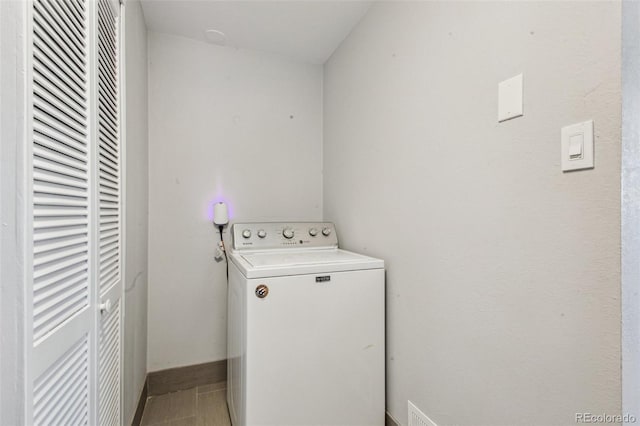 laundry area with washer / dryer