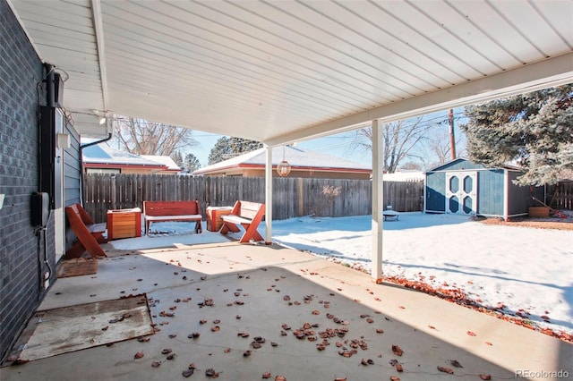 view of patio with a storage unit