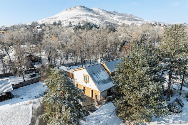 snowy aerial view featuring a mountain view