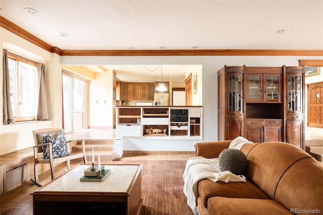 living area with recessed lighting, dark wood-type flooring, and crown molding