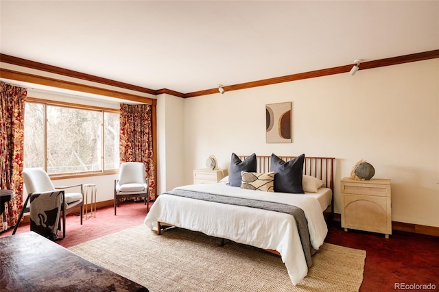 bedroom with baseboards, ornamental molding, and carpet flooring