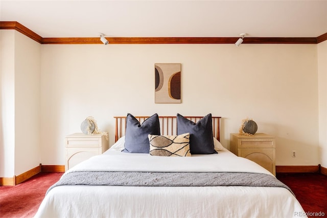 bedroom featuring crown molding, carpet, and baseboards