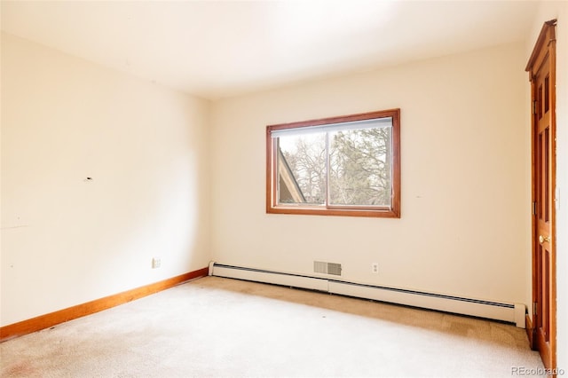 empty room featuring light colored carpet, baseboards, and a baseboard radiator