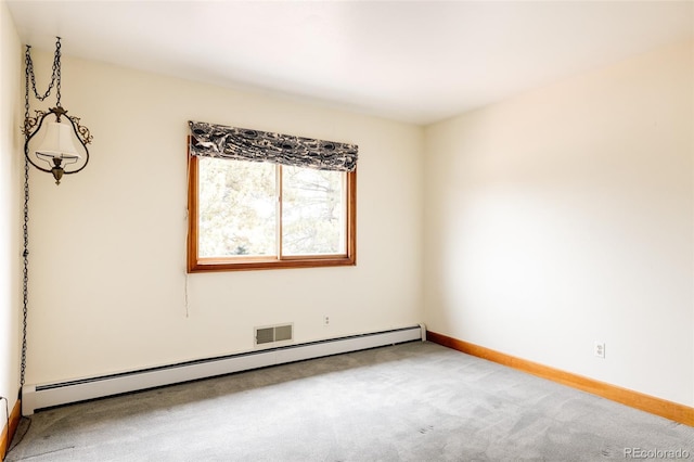 empty room with carpet flooring, baseboards, and a baseboard radiator