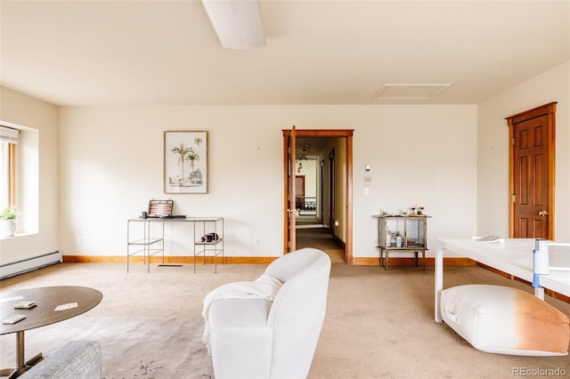 living room with light colored carpet, attic access, baseboards, and a baseboard radiator